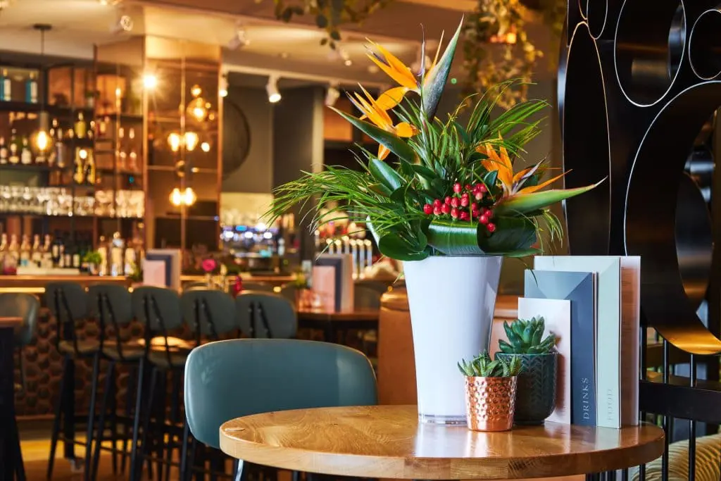 A tabletop posie and vase supplied to a nationwide pub chain.