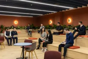 Jll birmingham, a group of team members sitting in the auditorium