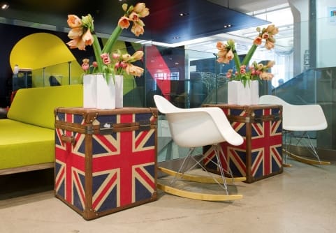 flowers on UK themed console tables in open plan office