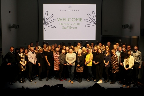 planteria staff at 2018 staff event on stage in front of large screen