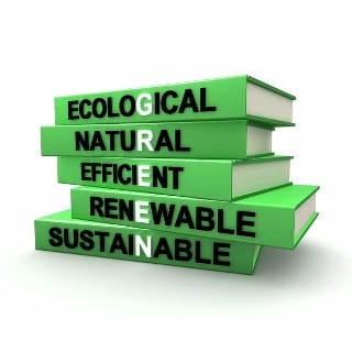 Green books stacked with ecological natural efficient renewable and sustainable on each book end
