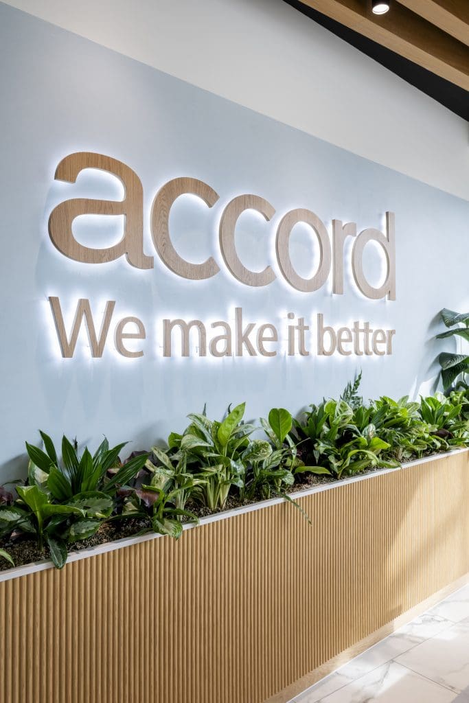 A sign with plants growing on it